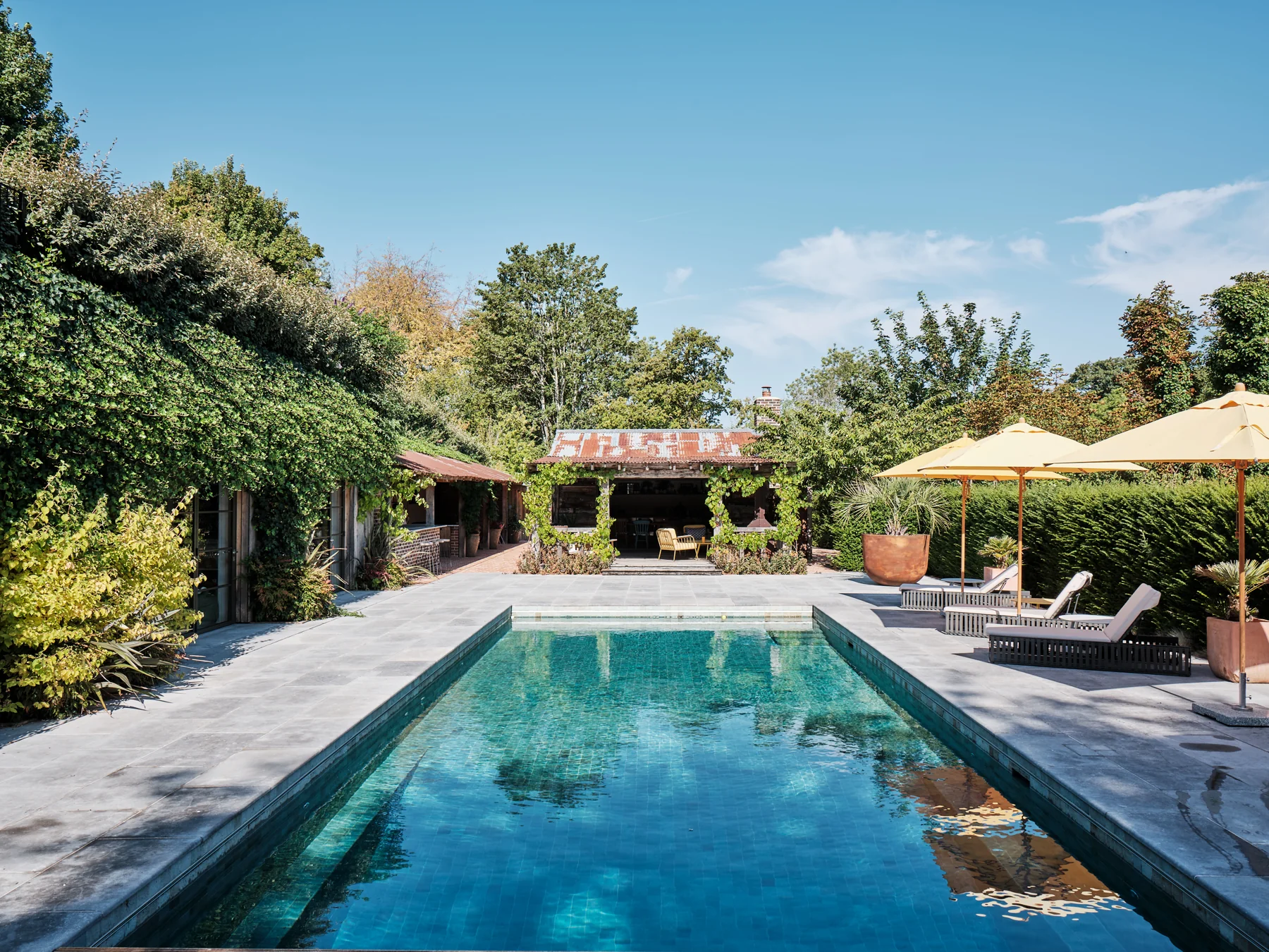 Pool and established gardens at The Old Forge